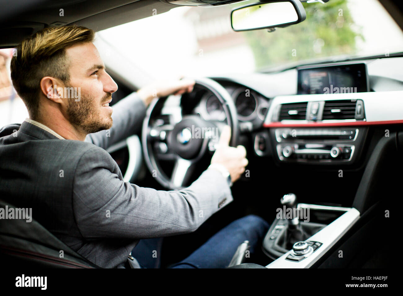 Young man driving in the  modern car Stock Photo