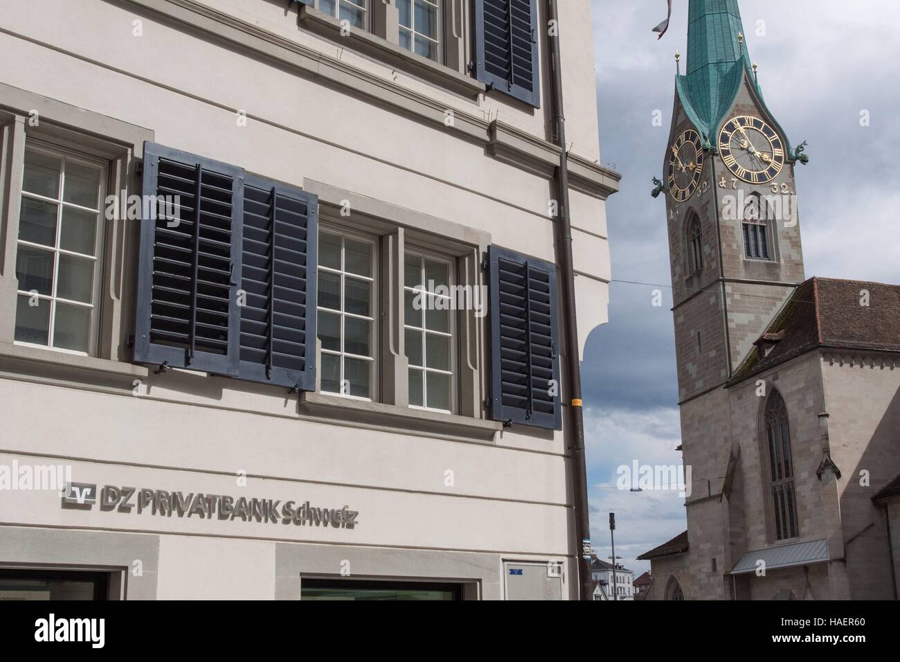 FACADE OF THE HEADQUARTERS OF A PRIVATE SWISS BANK WITH THE FRAUMUNSTER CHURCH IN THE BACKGROUND, TAX HAVEN, TAX EVASION, CITY OF ZURICH, CANTON OF ZURICH, SWITZERLAND Stock Photo