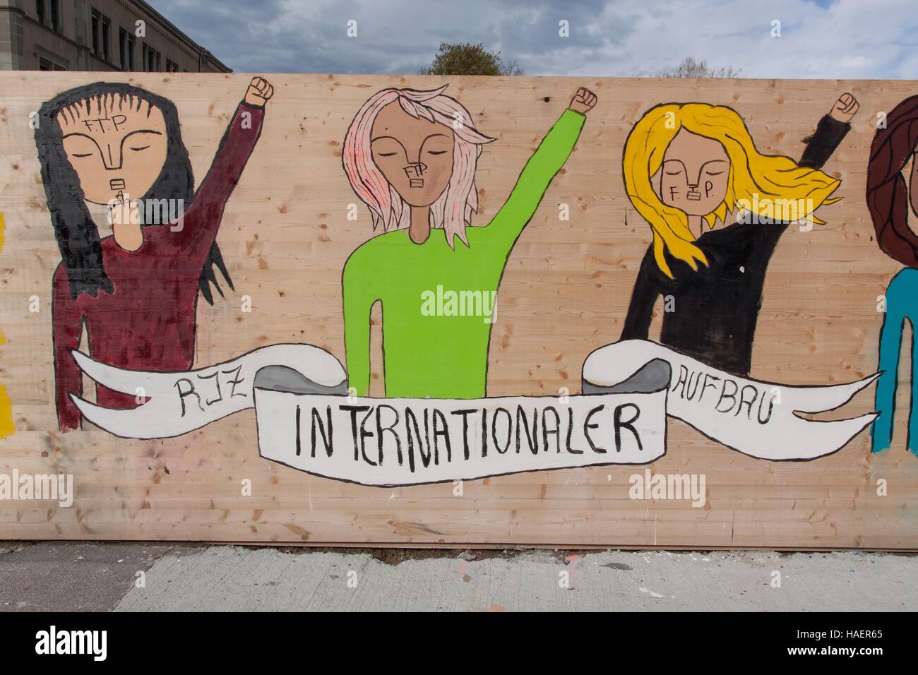 GRAFFITI WITH THE DEMANDS ON THE INTERNATIONAL FEMINIST MOVEMENT ON THE FENCE AROUND A CONSTRUCTION SITE IN THE CENTER OF ZURICH, CANTON OF ZURICH, SWITZERLAND Stock Photo