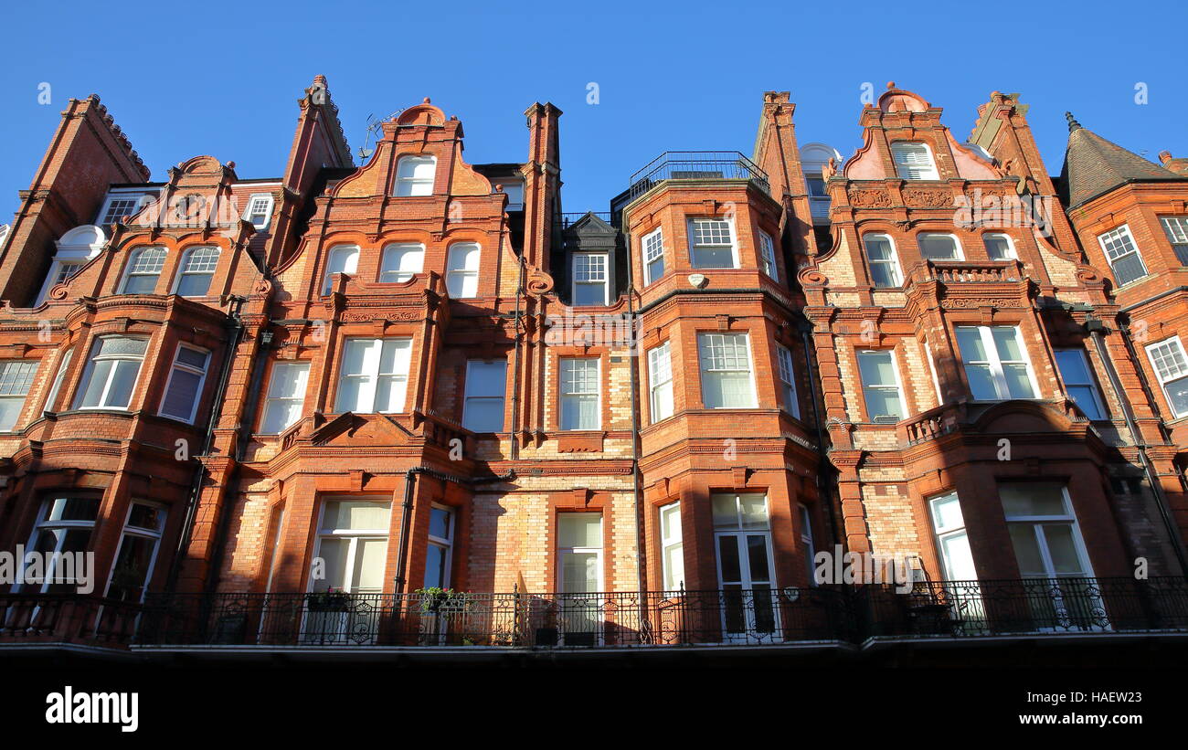 LONDON, UK Red brick Victorian houses facades in the borough of