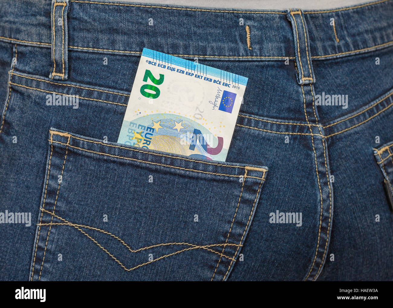Banknote 20 euro sticking out of the back jeans pocket. Money for travel  and shopping Stock Photo - Alamy