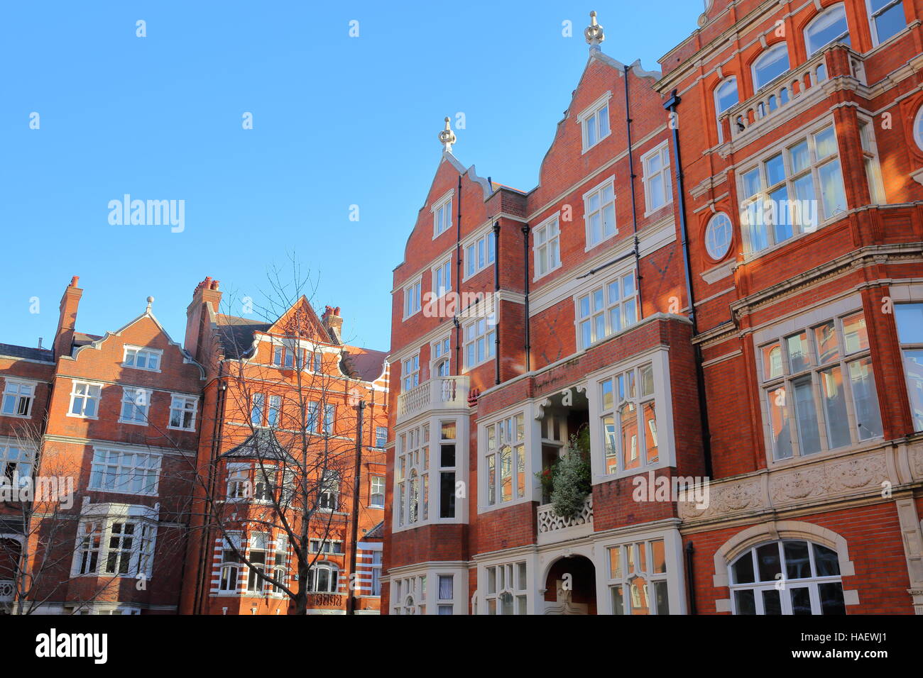 LONDON, UK Red brick Victorian houses facades in the borough of
