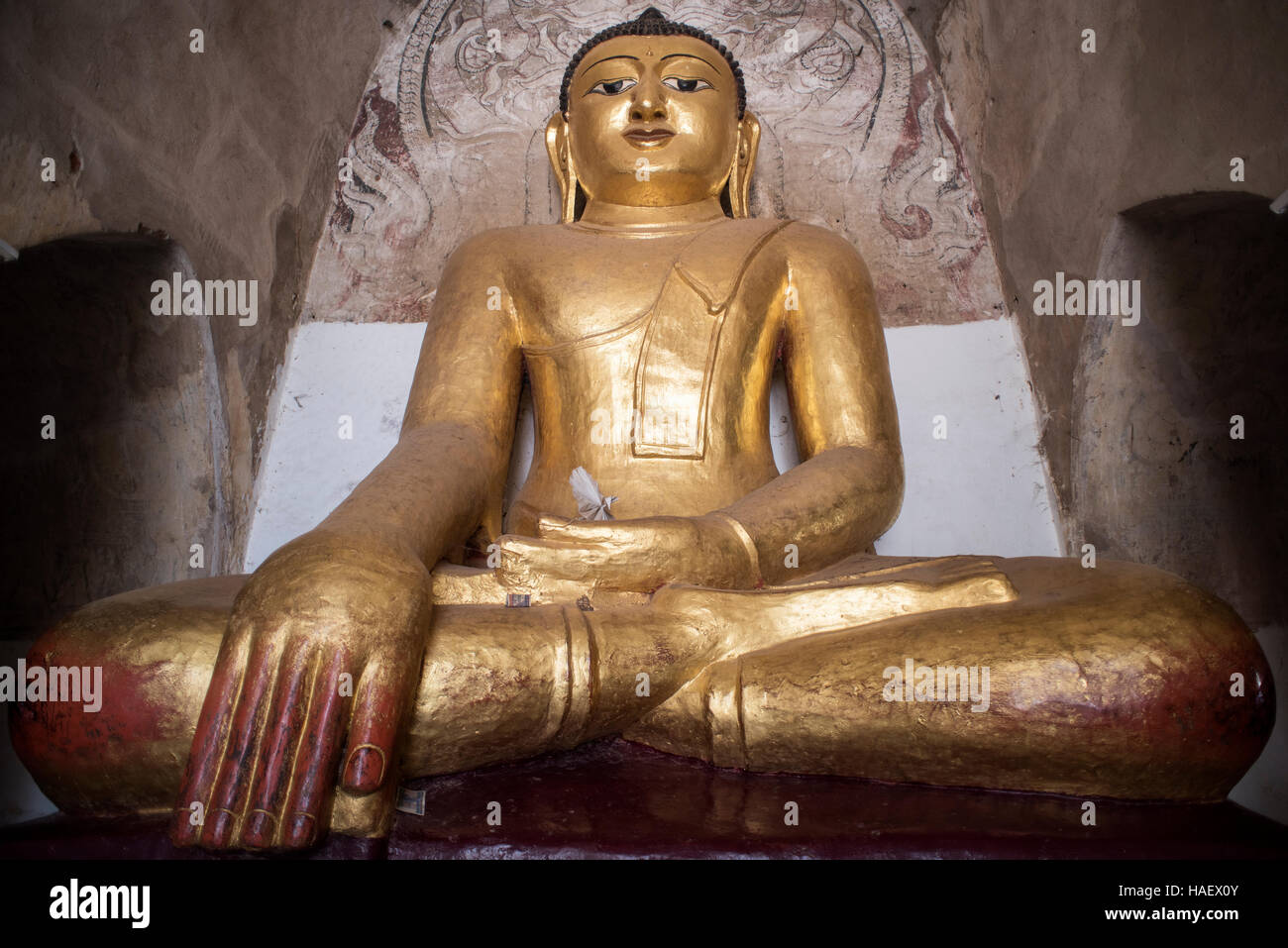 Golden Buddha statue in one of 2000+ temples in Bagan, Myanmar Stock ...