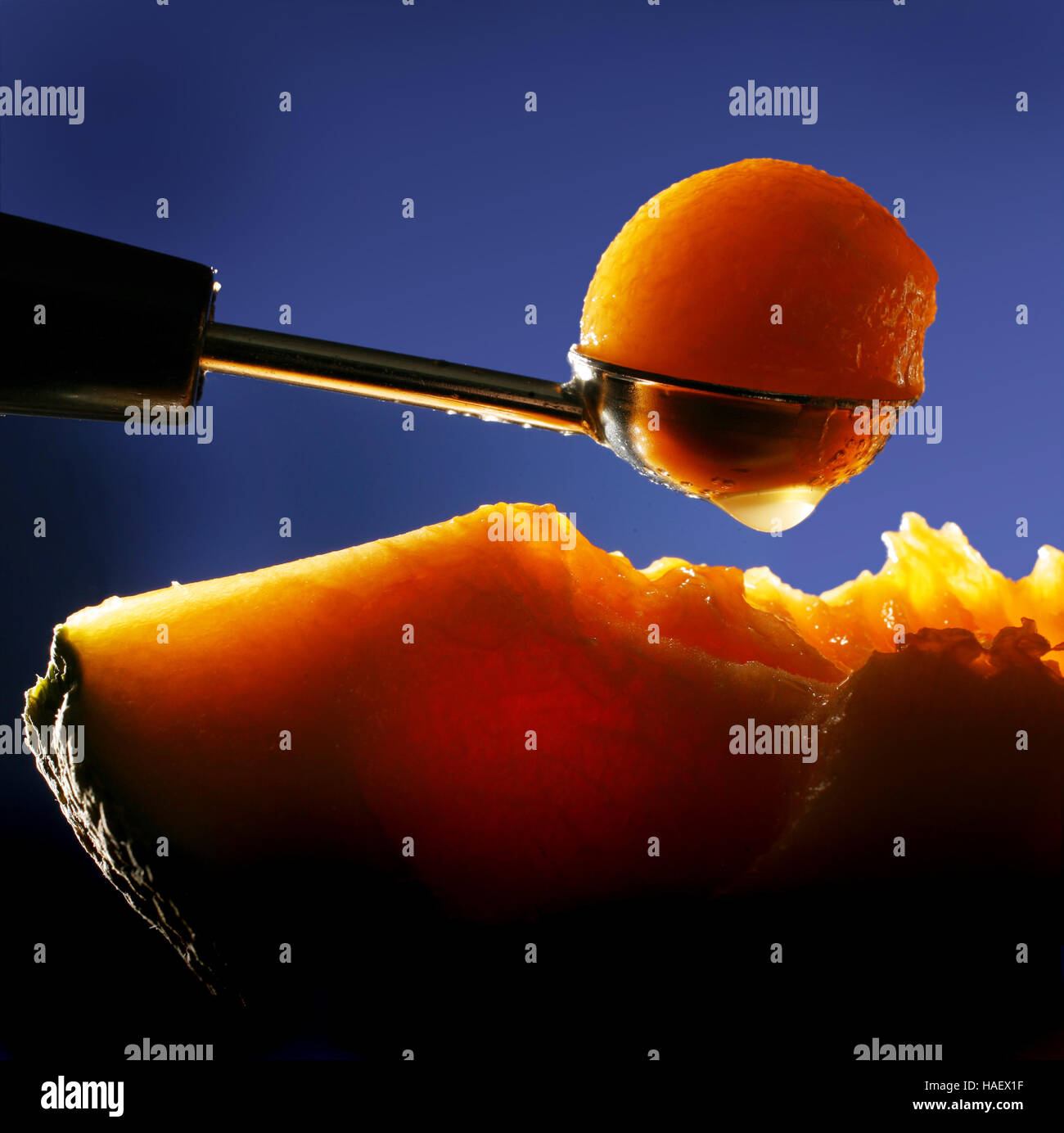 A melon baller is used to scoop out a juicy ball of cantaloupe Stock Photo Alamy