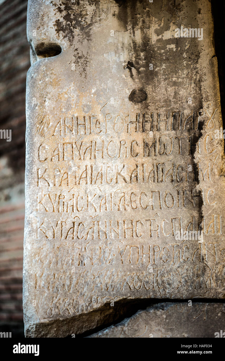 Detail of ancient writing on a rock at the Walls of Thessaloniki, Located at the Big Door, Portara Stock Photo