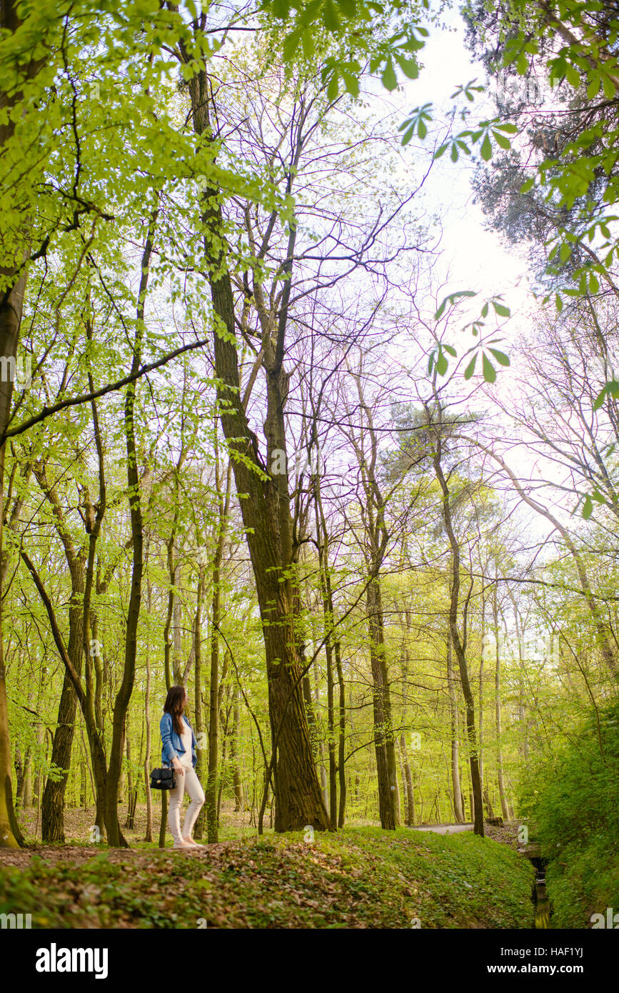 Young girl on a walk in the forest Stock Photo - Alamy