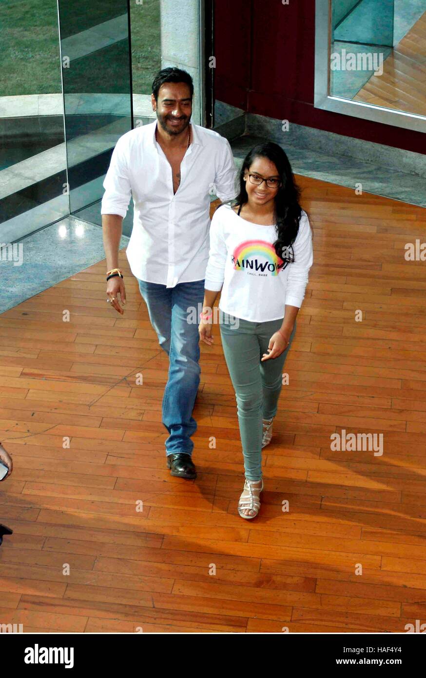 Bollywood actor Ajay Devgn with his daughter press conference of Smile Foundation announce new campaign She Can Fly Mumbai Stock Photo