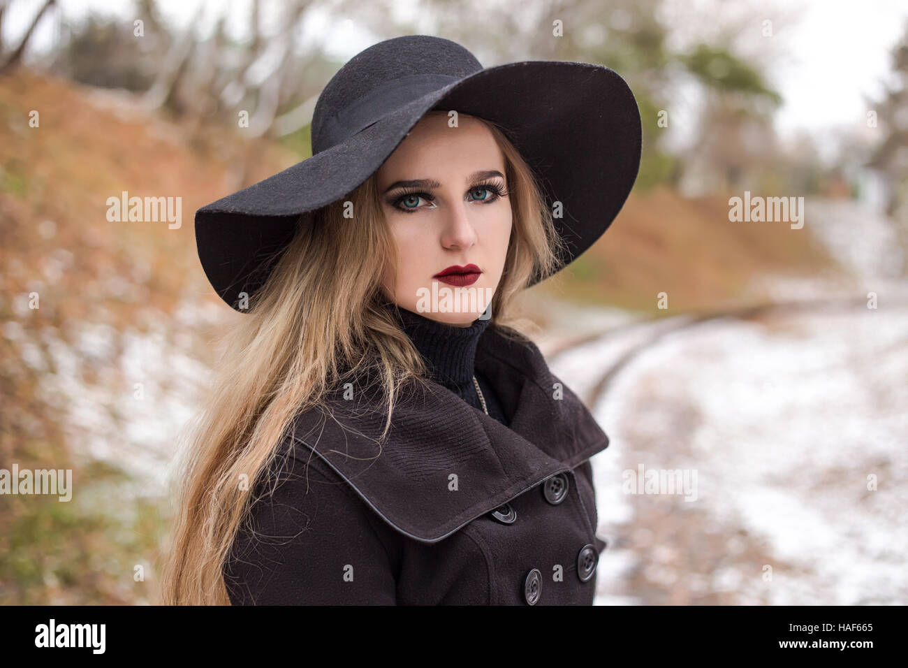 Portrait of a young beautiful woman in black hat retro style Stock ...