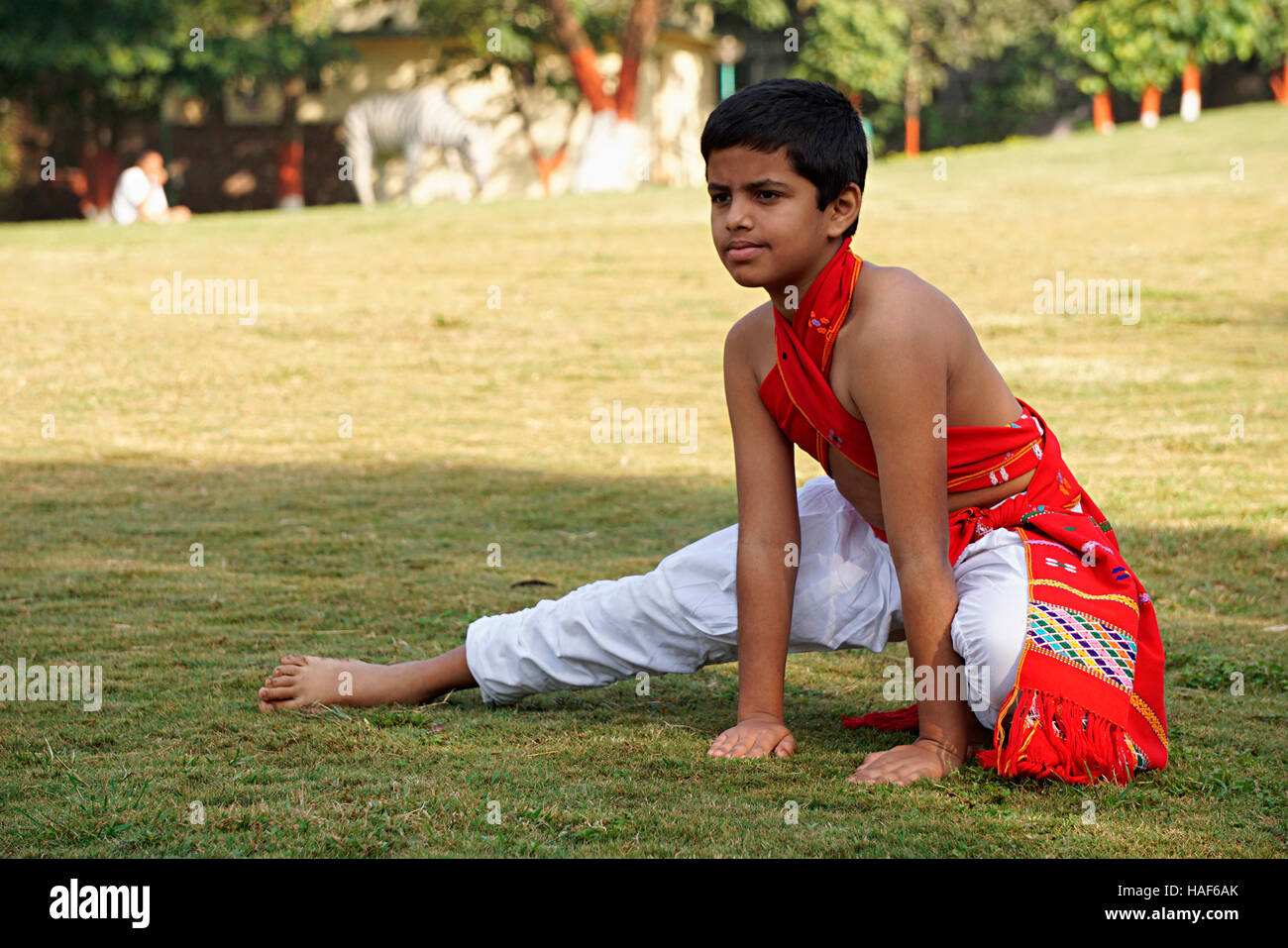 Boy doing whirling movement of right feet called Chatravali, covering the floor like an umbrella, Pune, Maharashtra. Stock Photo