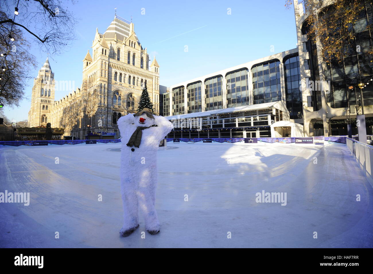 An actor plays The Snowman during a photo call at the Natural History Museum Ice Rink for the theatre production of The Snowman, running at the Peacock Theatre in London. Stock Photo