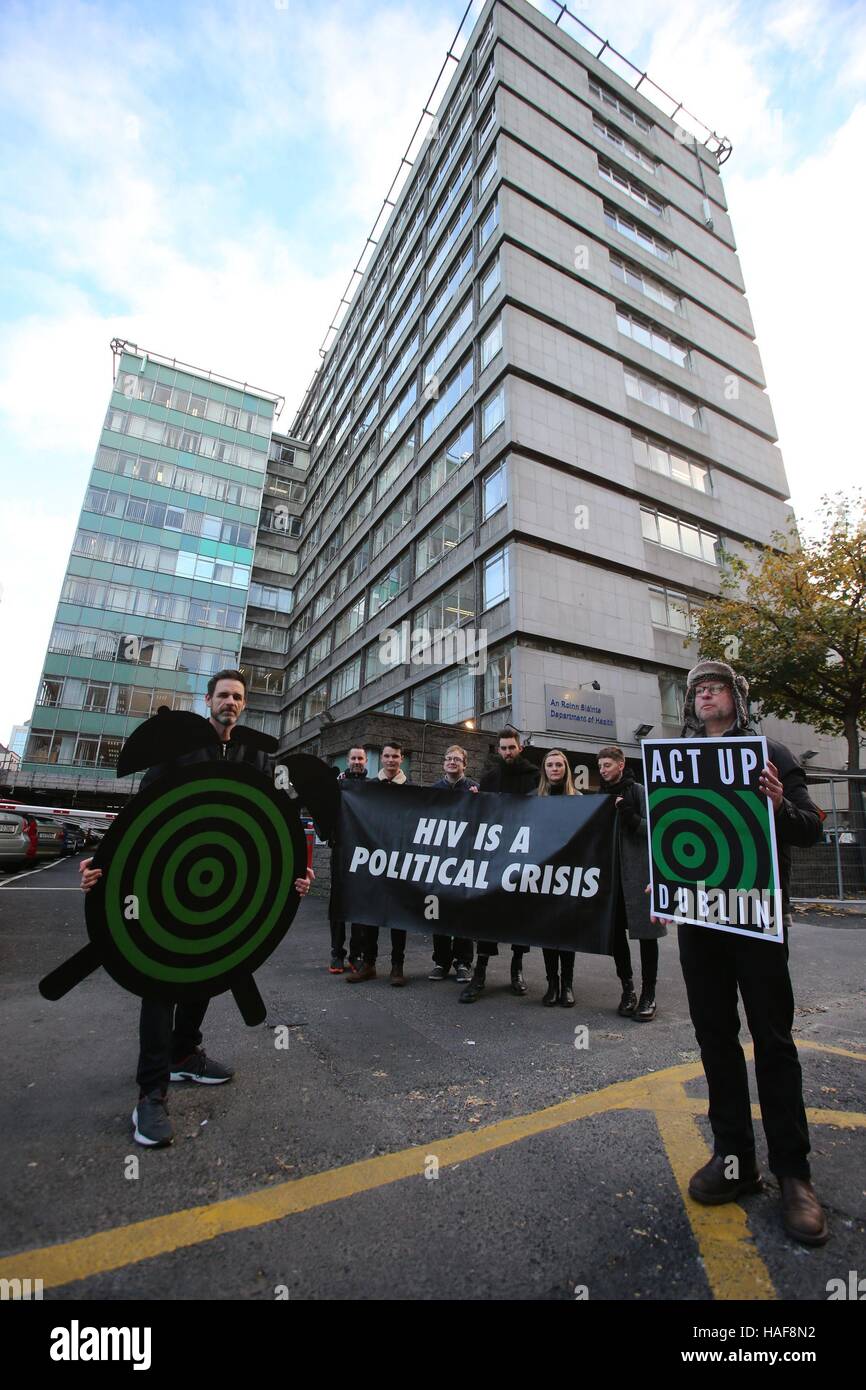 Members of the Act UP Dublin LGBT activist group protest outside the Department of Health in Dublin on the eve of World Aids day to highlight the rise of new HIV cases in Ireland. Stock Photo