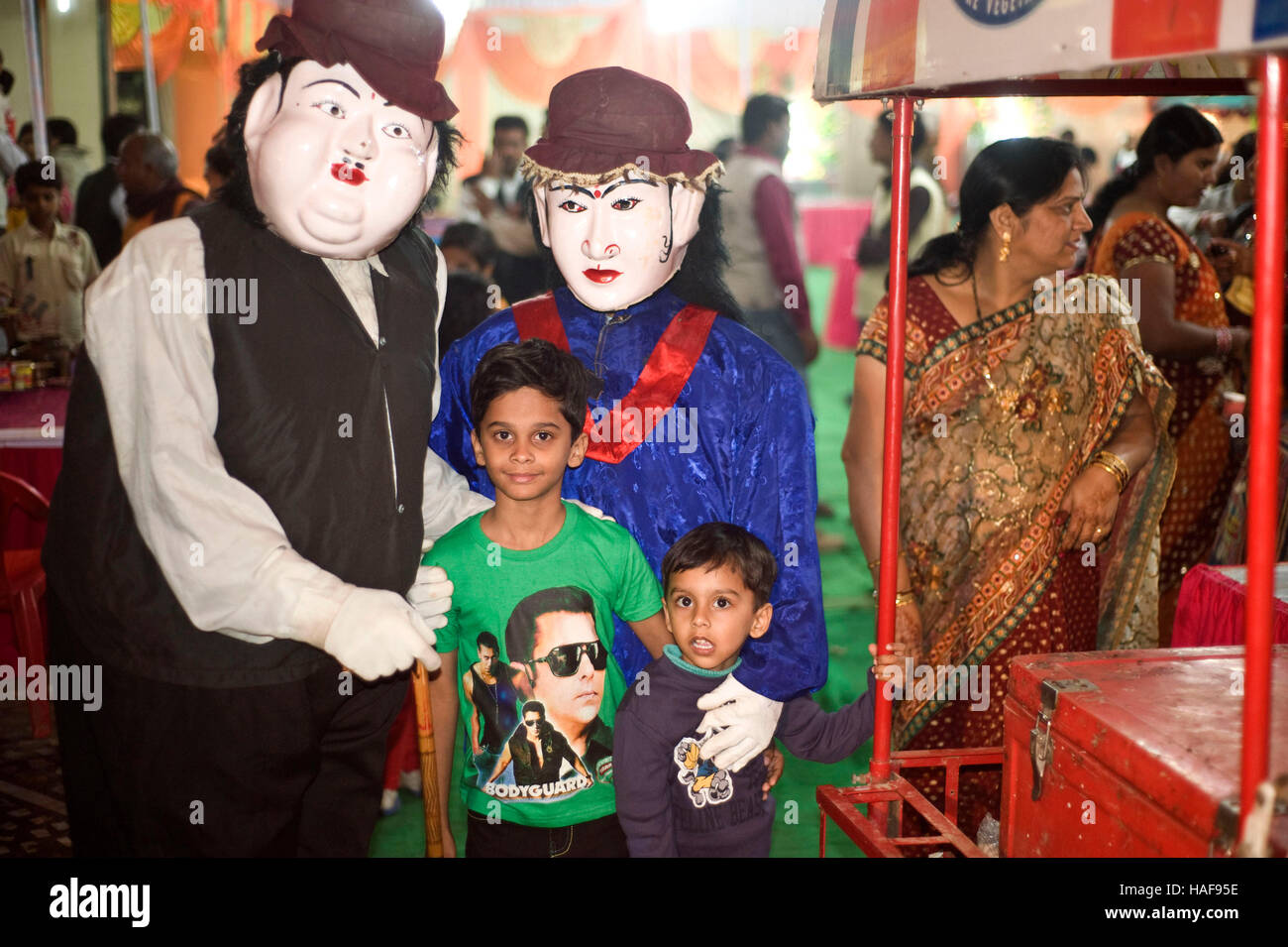 Two boys with Live cartoon characters in north indian wedding function in  jaunpur Stock Photo - Alamy
