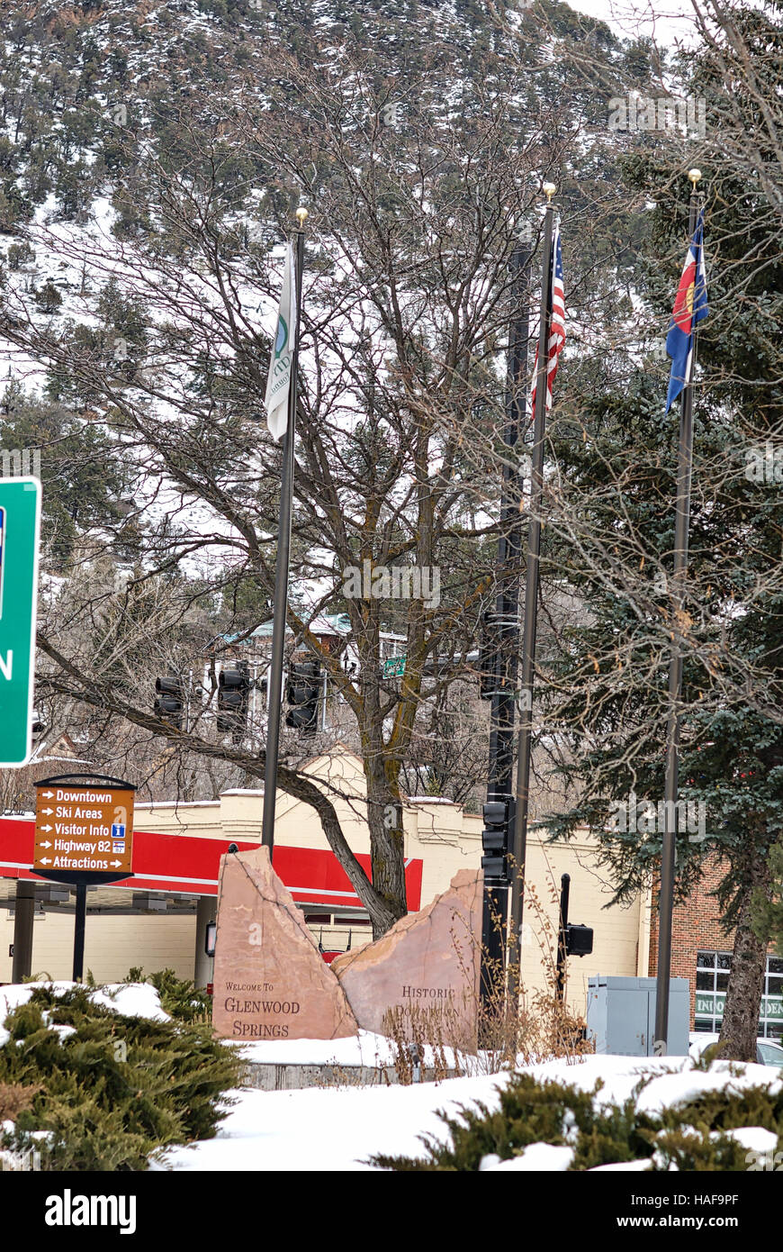 Welcome to Glenwood Springs, Colorado, rock sign with flags in a local park. Stock Photo