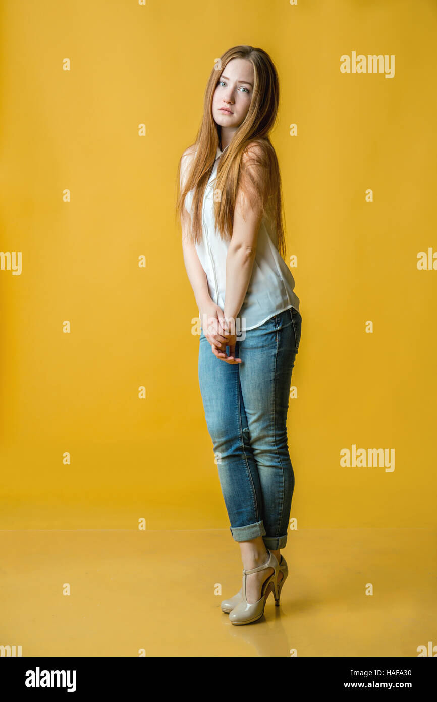 Full length portrait of a woman in casual cloth standing Stock Photo ...