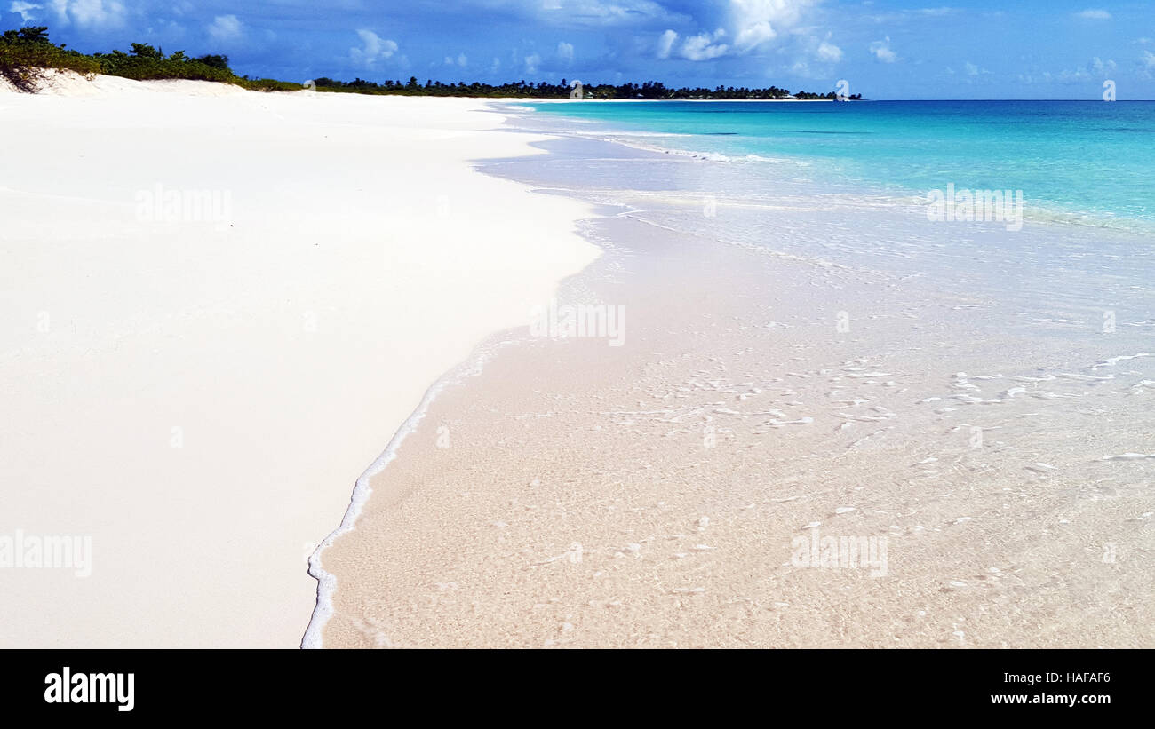 Crystal clear water of the tropical sea and white sand beach