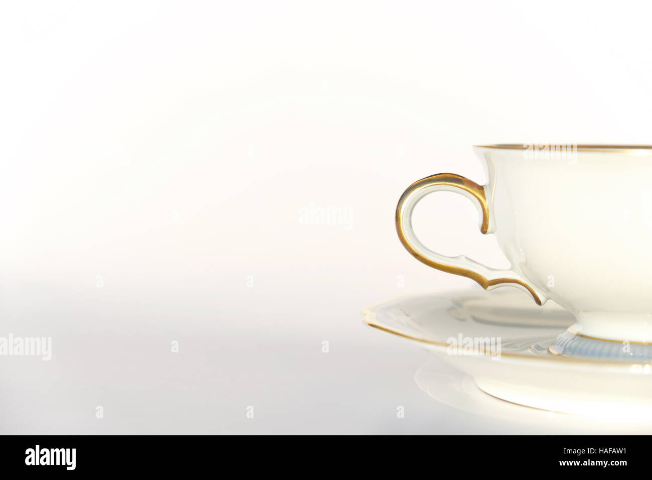 beautiful porcelain tea cup and saucer on white background with copy space Stock Photo
