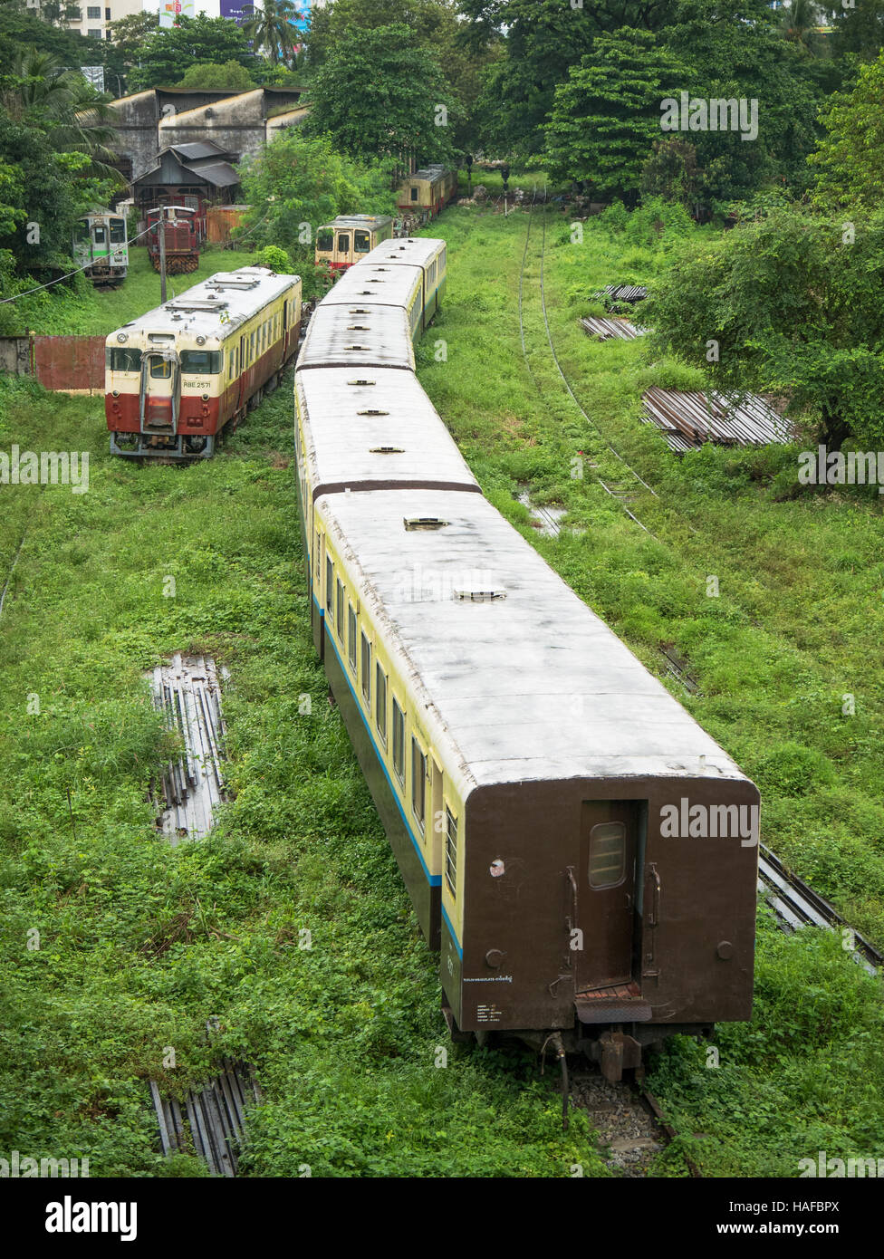 Passenger trains at a side track at Yangon Central Railway Station, Myanmar. Stock Photo