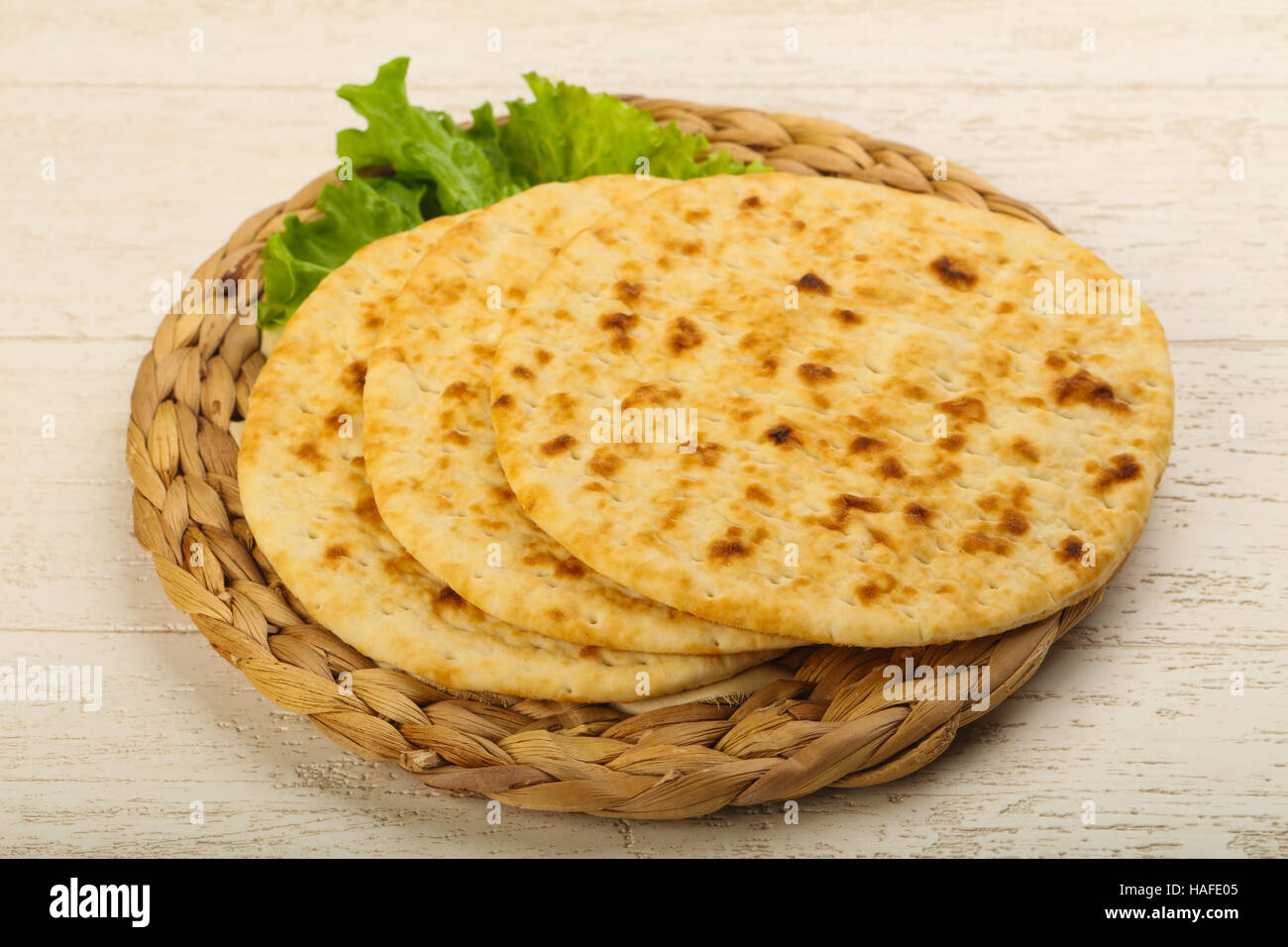 Pita bread with salad over wood background Stock Photo - Alamy