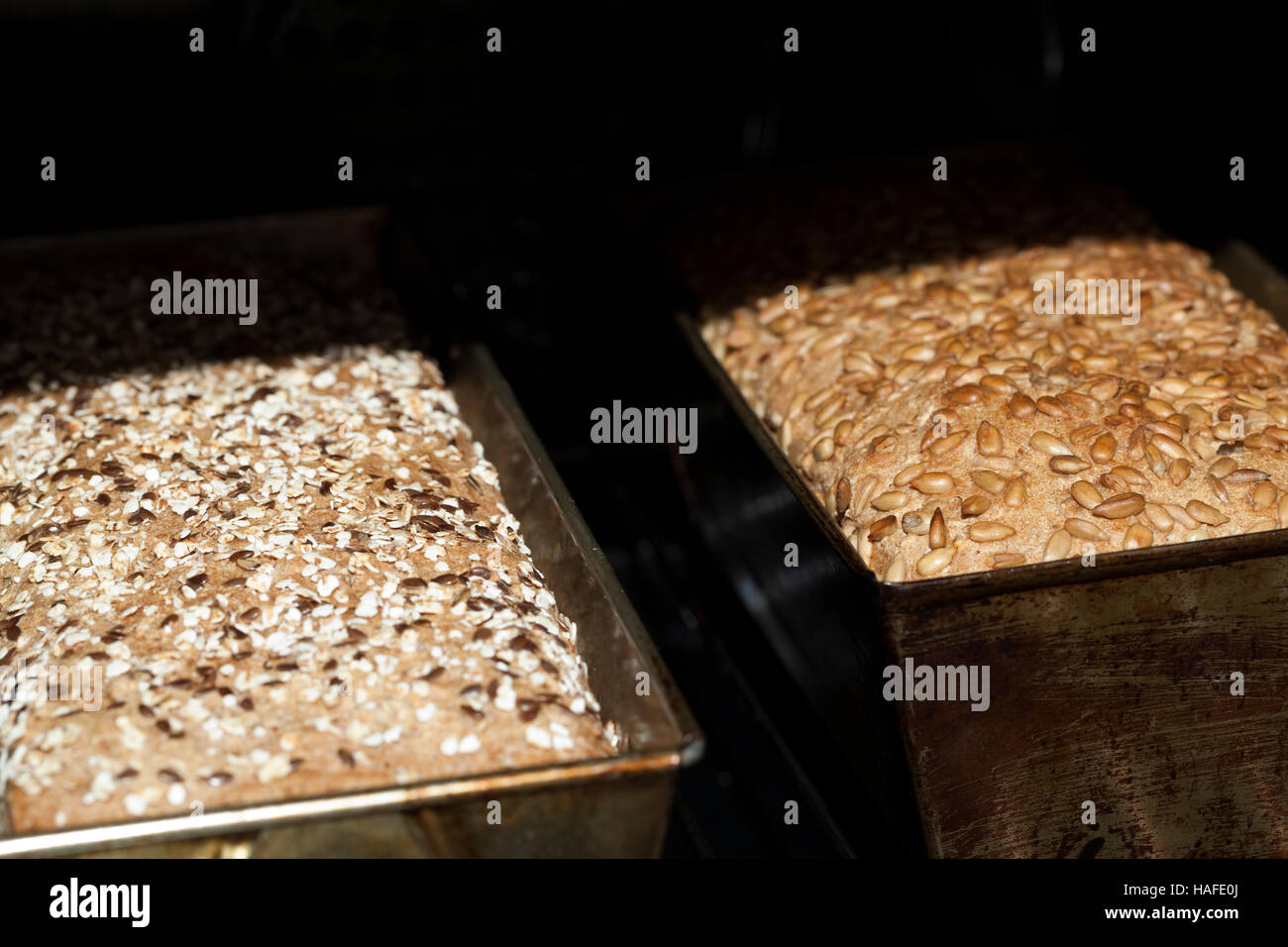 two hot bread in bread stove as background Stock Photo