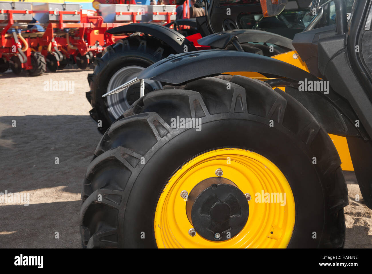 Wheels of agricultural machinery closeup outdoors on a sunny day Stock