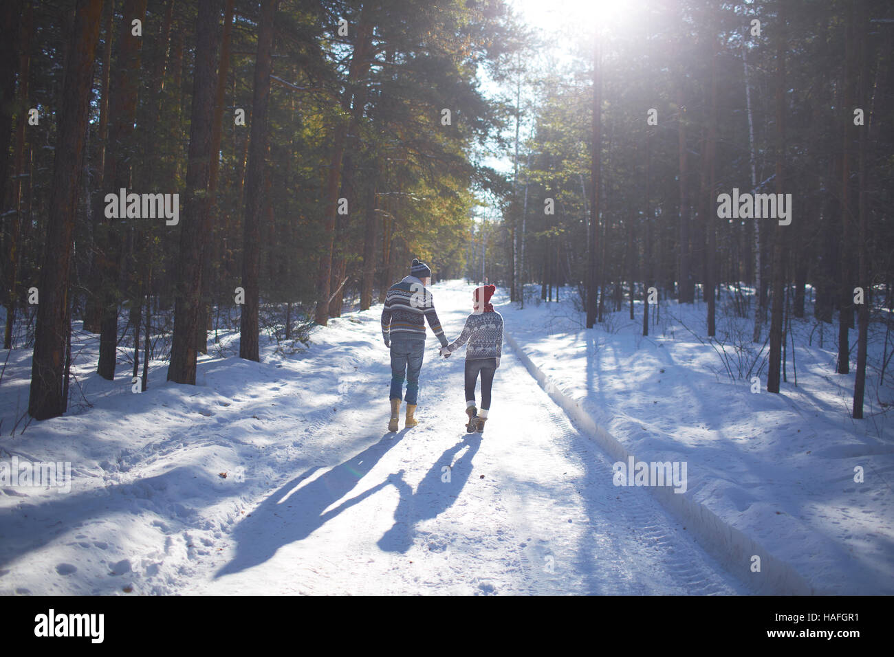 Romantic couple snow rear view hi-res stock photography and images - Alamy