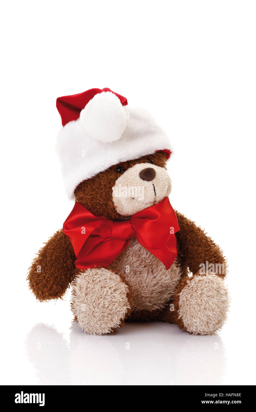 Teddy bear with a Christmas hat Stock Photo - Alamy
