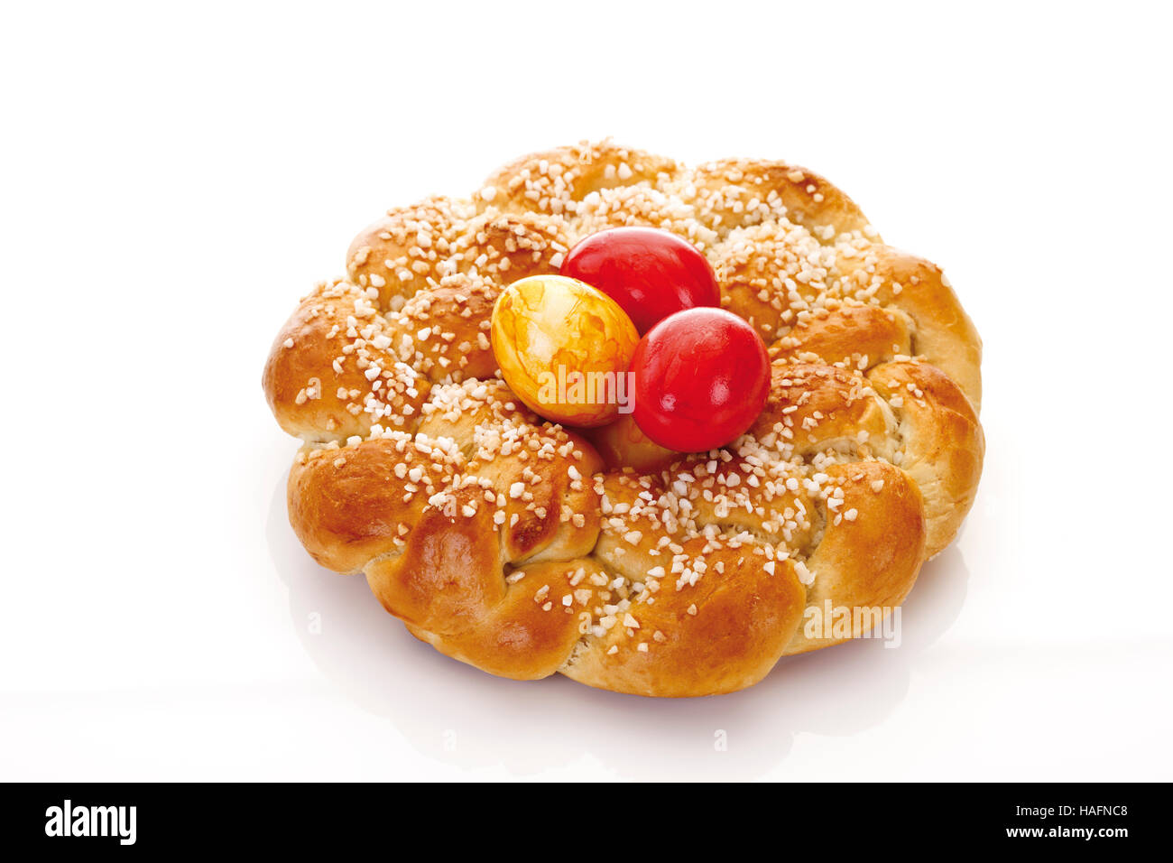 Hefekranz, German pastry with yellow and red easter eggs Stock Photo