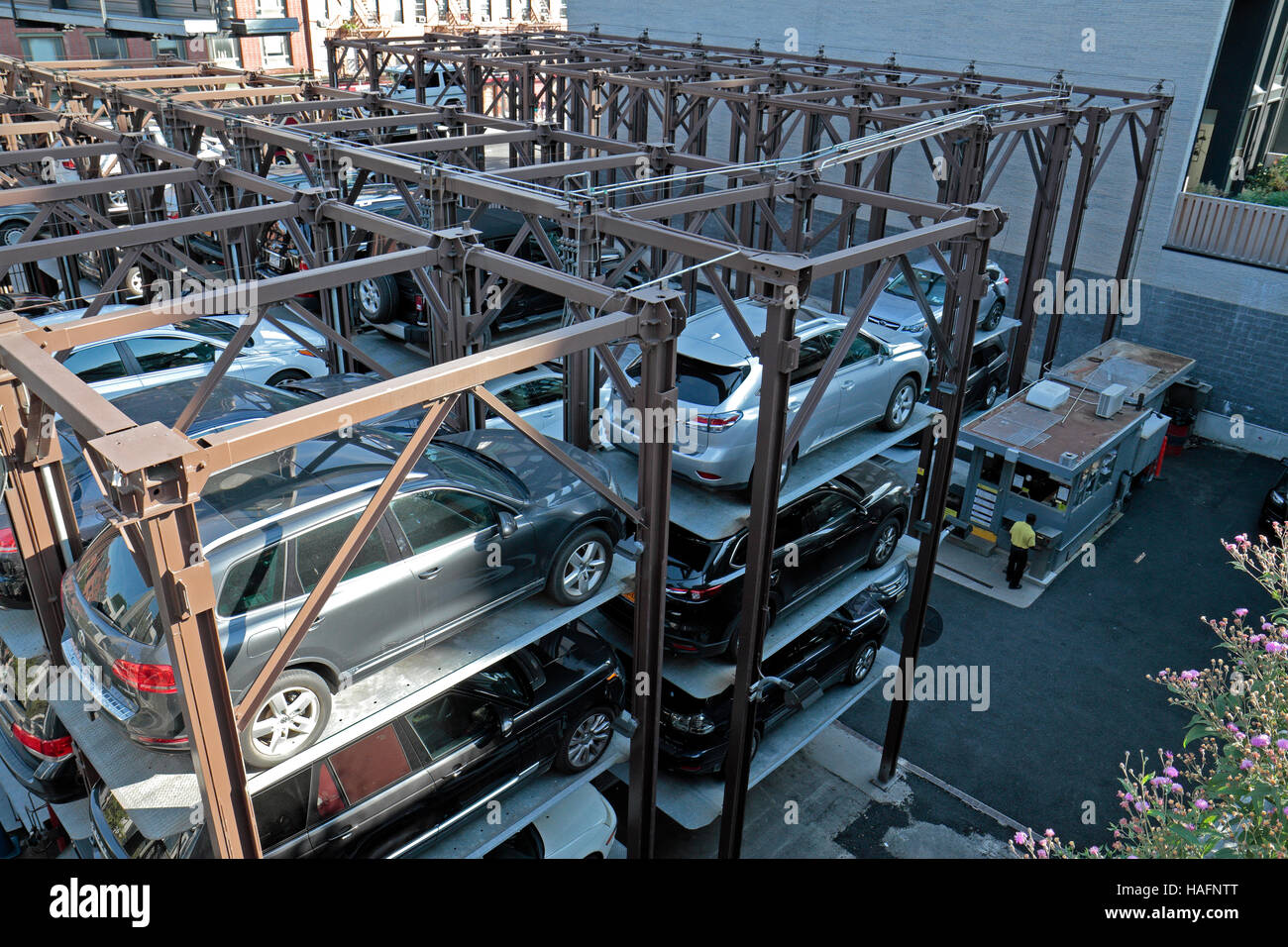 A multi level, stacked car parking system (called Edison ParkFast) in the Chelsea area of New York City, United States. Stock Photo