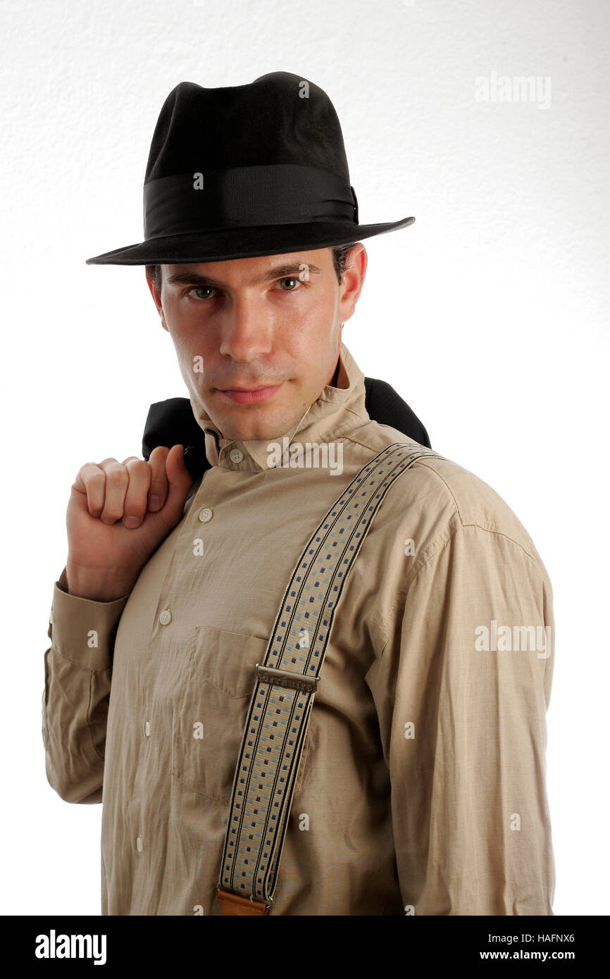 Portrait of a young man in 20's style wearing a hat, shirt and braces Stock  Photo - Alamy