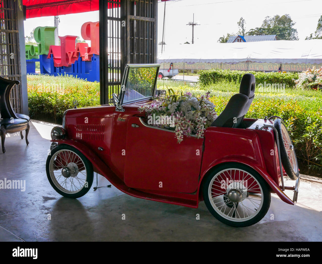 decorative red old car with flowers Stock Photo