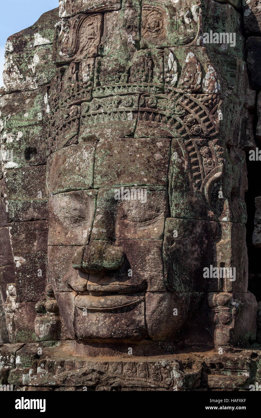 Enigmatic stone face of King Jayavarman VII is at the Bayon, Angkor Thom, Siem Reap, Kingdom of Cambodia. Stock Photo