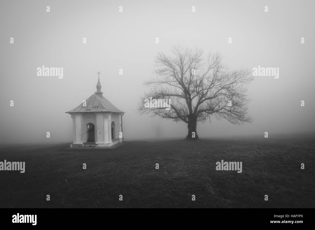 Chapel in the fog. Paclawska Calvary. Stock Photo
