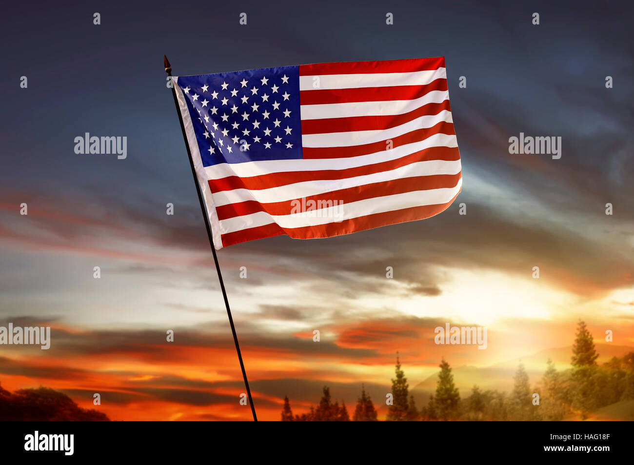 USA flag on the hill with sunset sky background Stock Photo Alamy