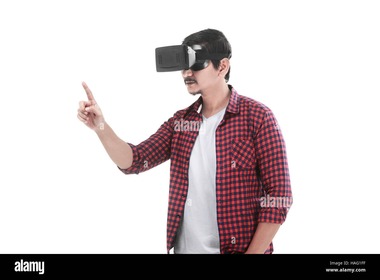 Young asian man experiencing virtual reality through a VR headset ...