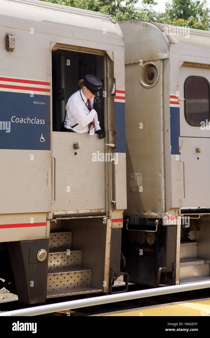 Conductor on board a Westbound Amtrak train at Sedalia, Pettis County