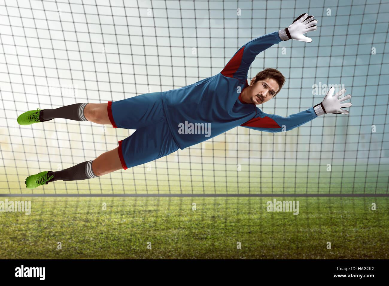 Image of goalkeeper catch ball in front of goalpost Stock Photo Alamy