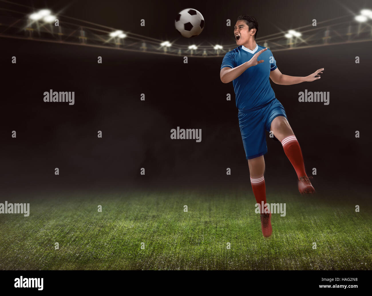 Image of soccer player header on the stadium Stock Photo Alamy
