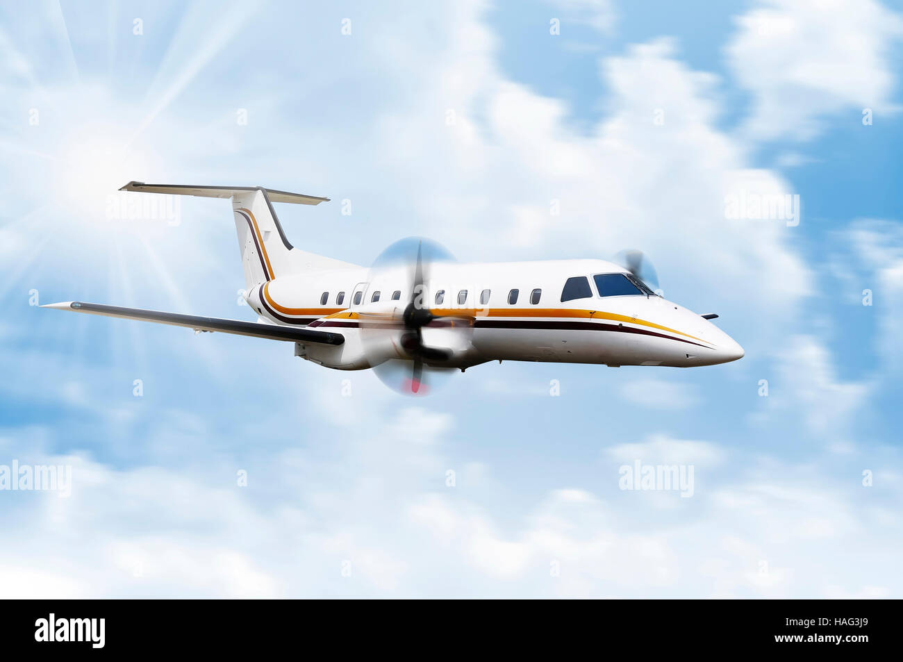 Propeller plane flying on the blue sky Stock Photo Alamy