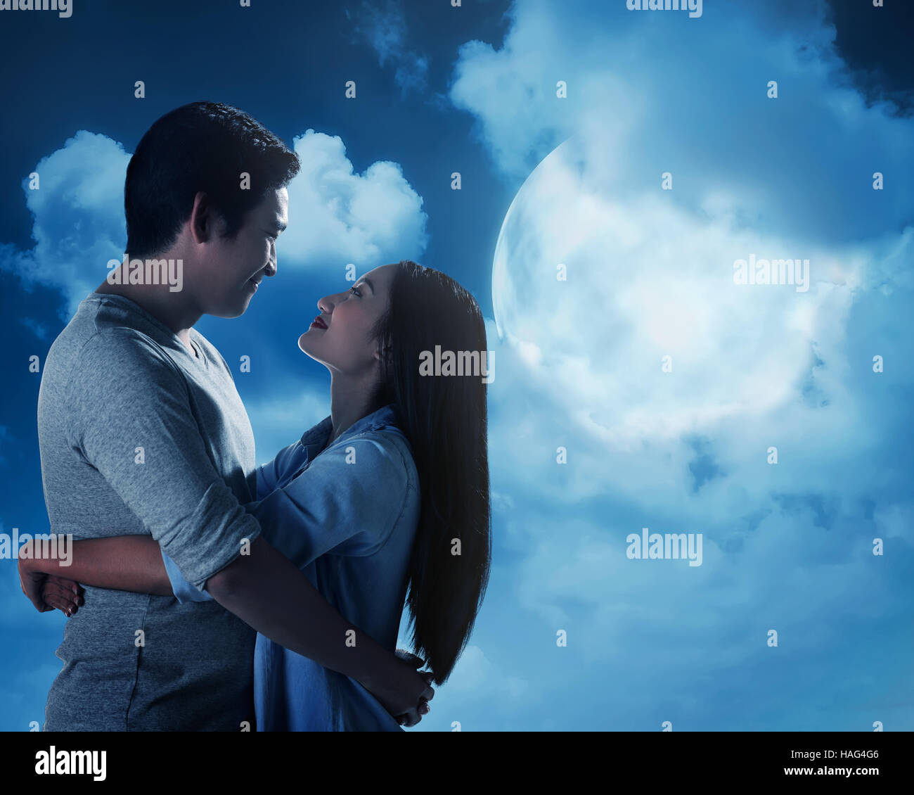 Silhouette of couple under full moon. Valentine day concept Stock Photo ...