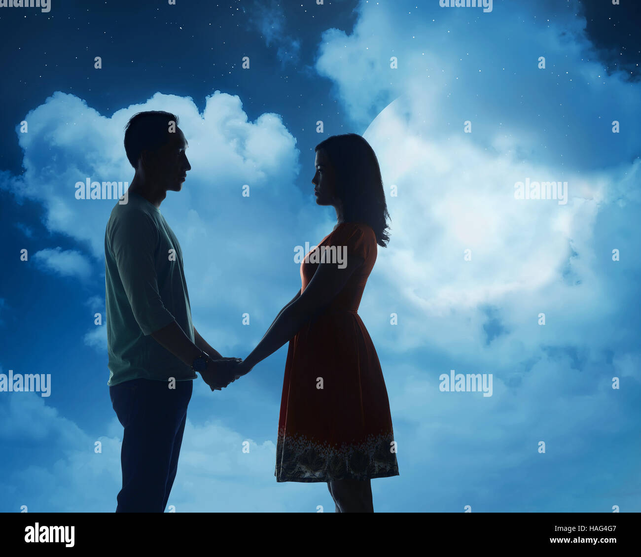 Silhouette of couple under full moon. Valentine day concept Stock Photo ...