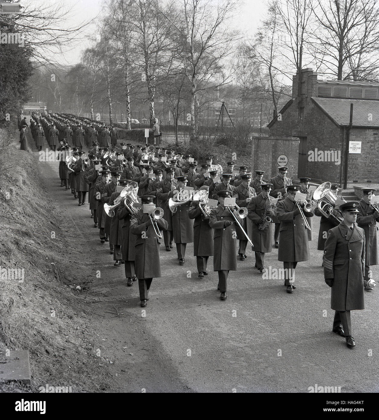 1965, historical, military marching band leads a large group of