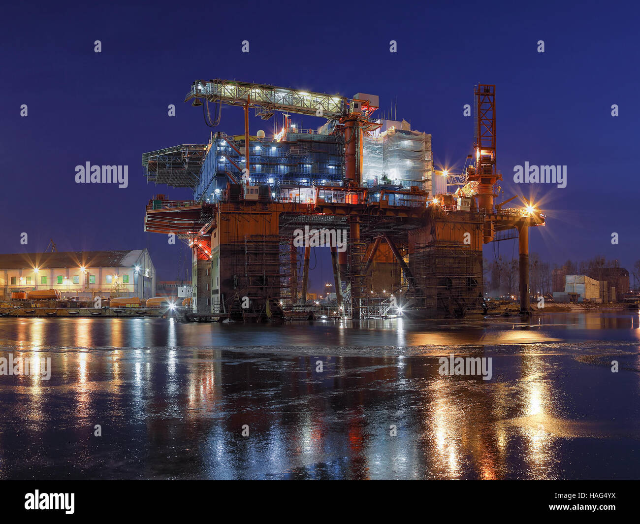 Oil rig under construction at night in Gdansk, Poland. Stock Photo