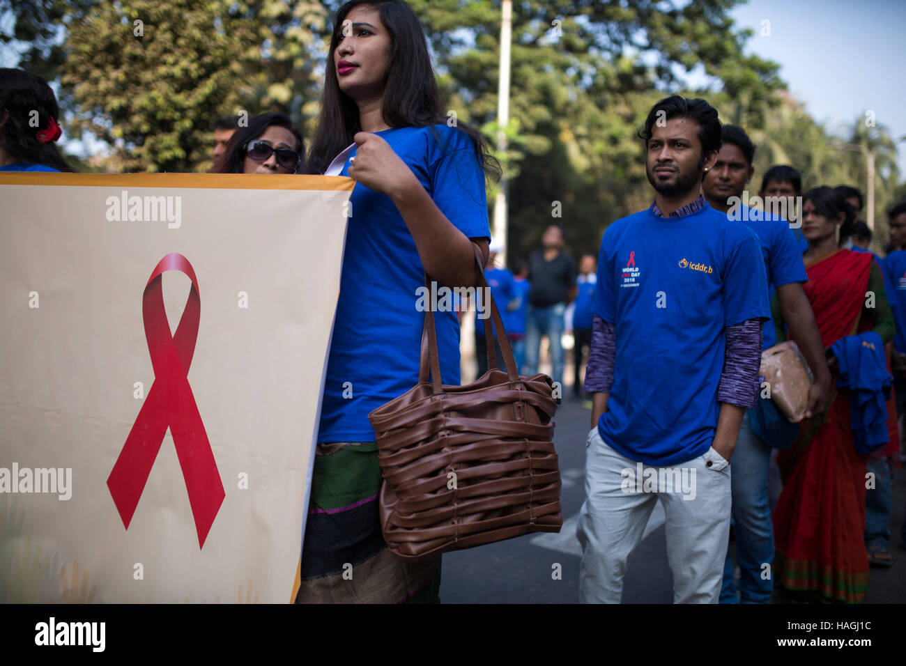 DHAKA, BANGLADESH - DECEMBER 01 :  Bangladeshi activist,sex worker, few wariness organization and transexuals attend a rally on the occasion of the World Aids Day in Dhaka, Bangladesh on December 01, 2016.  According to latest government figures, a total of 3,241 HIV-positive patients have been identified in Bangladesh since 1989, among who 1,299 became AIDS patients and 472 died while the UN estimates the number to be between even higher, between 8,000 and 16,000. Stock Photo