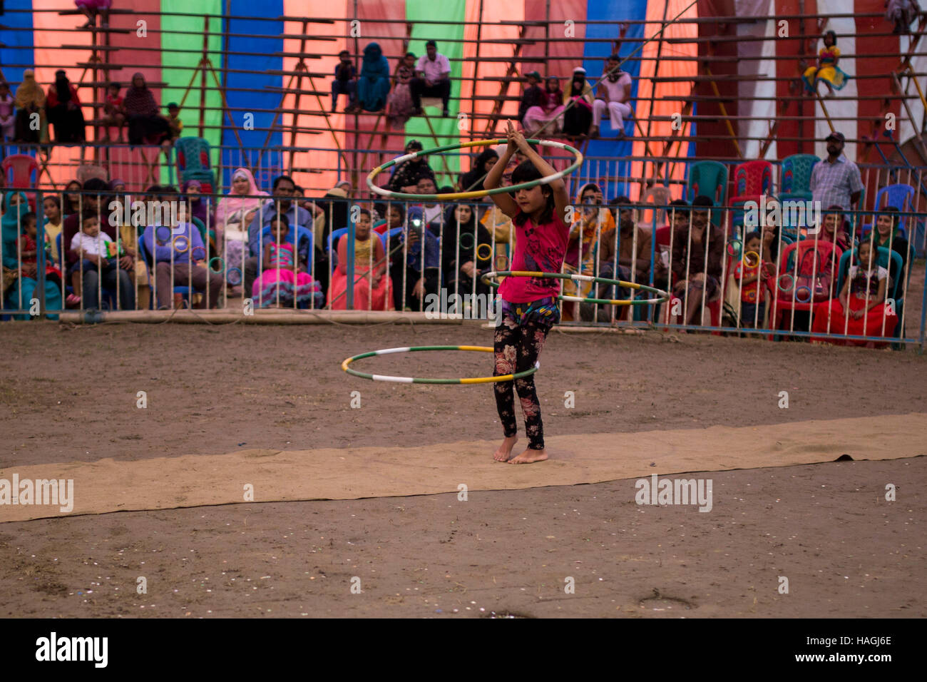 Dhaka, Bangladesh. 29th Nov, 2016. Acrobate doing trapeze inside a circus tent beside in Dhaka, Banhladesh on November 29, 2016. Circus is a popular form of entertainment for different levels of people of Bangladesh. Circus is all about fantasy. The performer entertain people showing different games including balance on rope, cycling, jump from the top, knife game and many. Some circus shows game with animals like lions, elephant, dogs, monkeys etc. circus is passing a hard time now. Credit:  zakir hossain chowdhury zakir/Alamy Live News Stock Photo