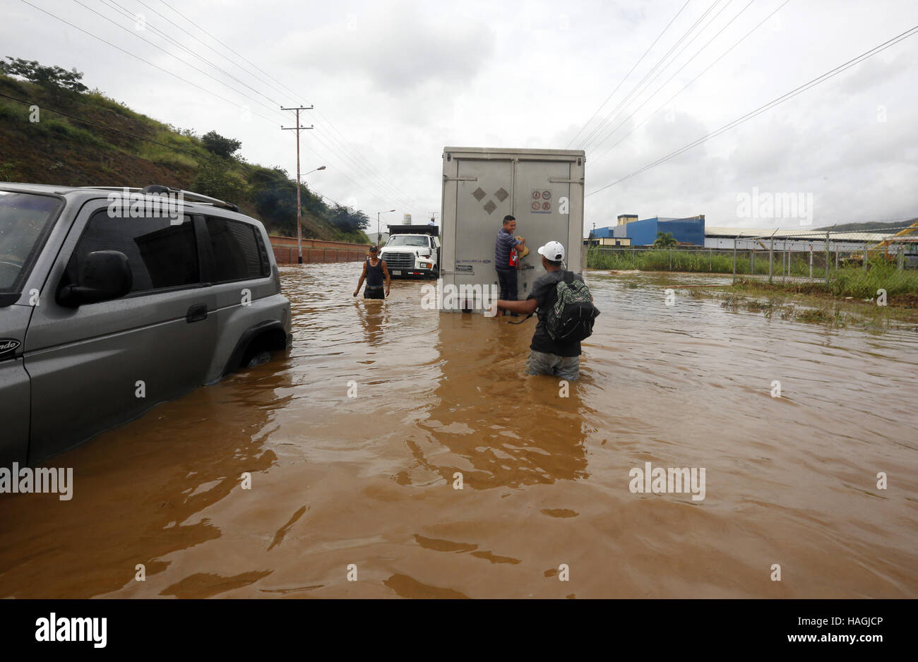 Valencia, Carabobo, Venezuela. 1st Dec, 2016. December 01, 2016 - Valencia, Carabobo, Venezuela - Large floods produced rains in 5 municipalities of Carabobo state, including San Diego, Guacara, Los guayos, Puerto cabello and Valencia. There are innumerable material losses, the amount of vehicles affected so far have been unquantifiable.There are two people missing, In Valencia, Venezuela. Credit:  Juan Carlos Hernandez/ZUMA Wire/Alamy Live News Stock Photo