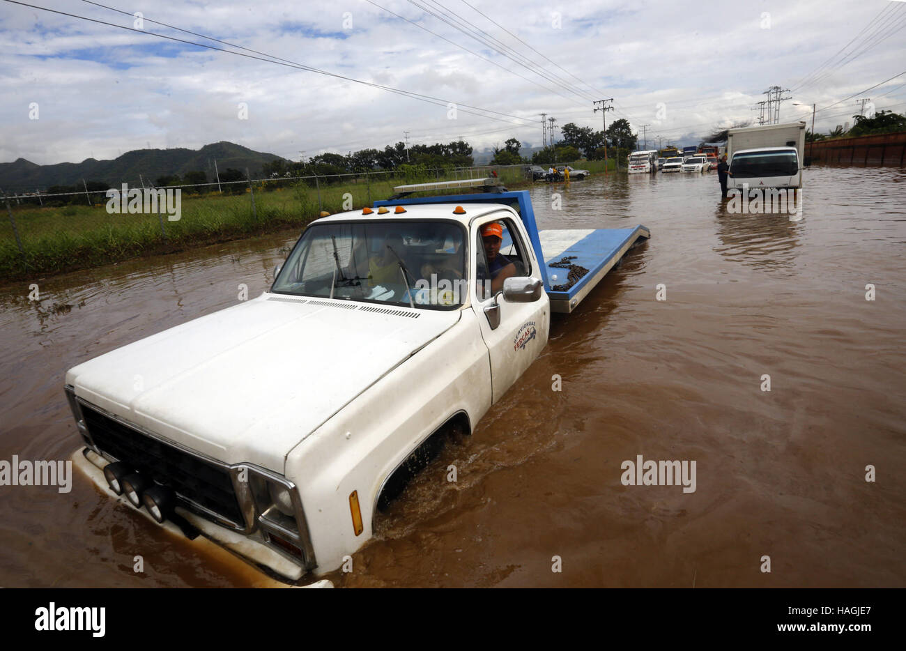 Valencia, Carabobo, Venezuela. 1st Dec, 2016. December 01, 2016 - Valencia, Carabobo, Venezuela - Large floods produced rains in 5 municipalities of Carabobo state, including San Diego, Guacara, Los guayos, Puerto cabello and Valencia. There are innumerable material losses, the amount of vehicles affected so far have been unquantifiable.There are two people missing, In Valencia, Venezuela. Credit: Juan Carlos Hernandez/ZUMA Wire/Alamy Live News Stock Photo