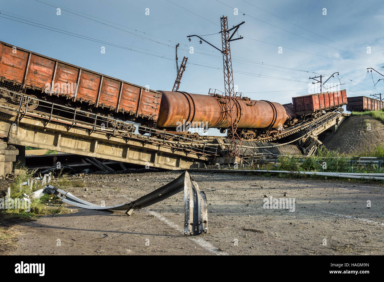 Destroyed bridge with wagons after the explosion terrorists Stock Photo