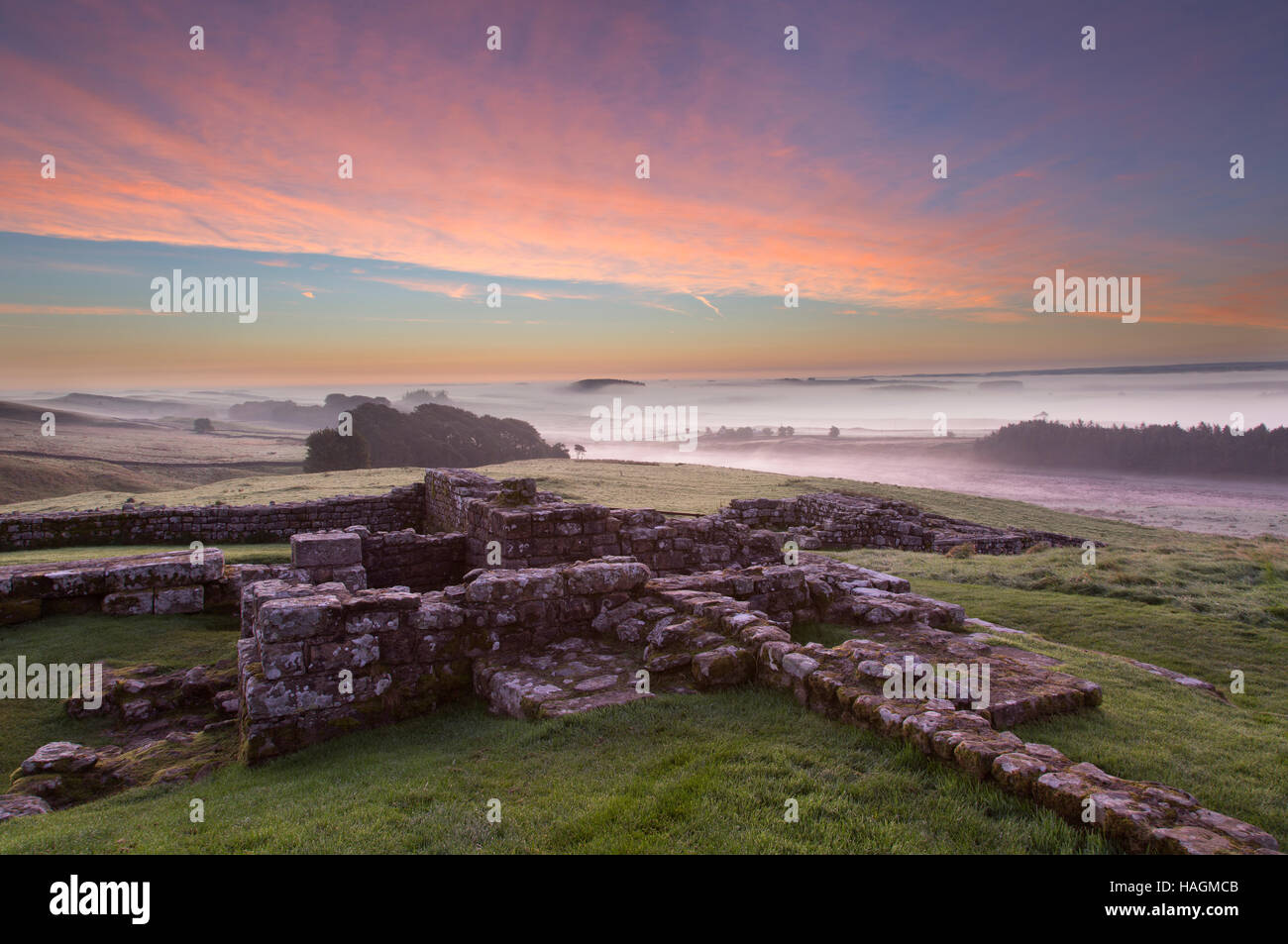 Dawn, low-lying mists at Housesteads Roman Fort, Hadrian's Wall, Northumberland, England Stock Photo