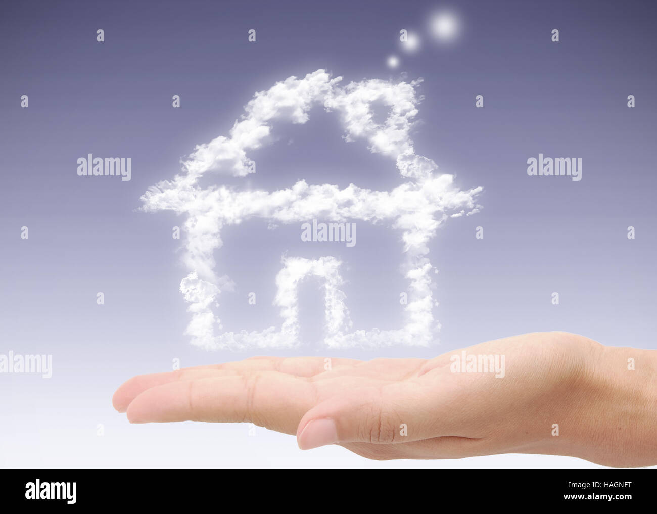 House made from clouds hovering over a hand Stock Photo - Alamy