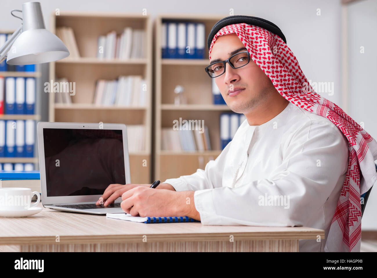 Arab businessman working in the office Stock Photo - Alamy